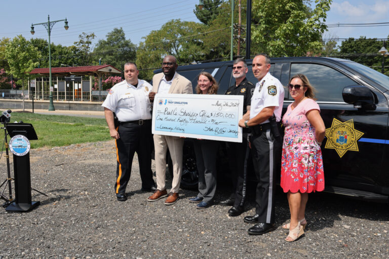 Burlington County officials hold a check