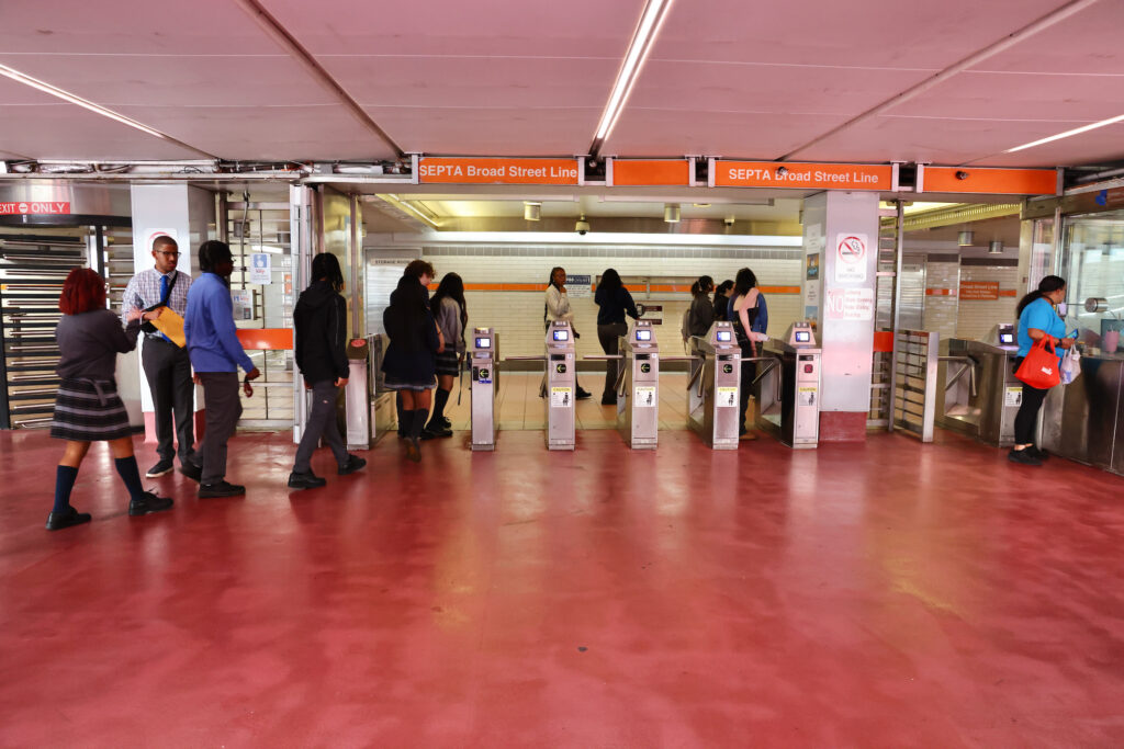 2024 08 27-e lee-philadelphia 15th street station-boarding turnstile Passengers enter the Broad Street Line at the 15th Street Station