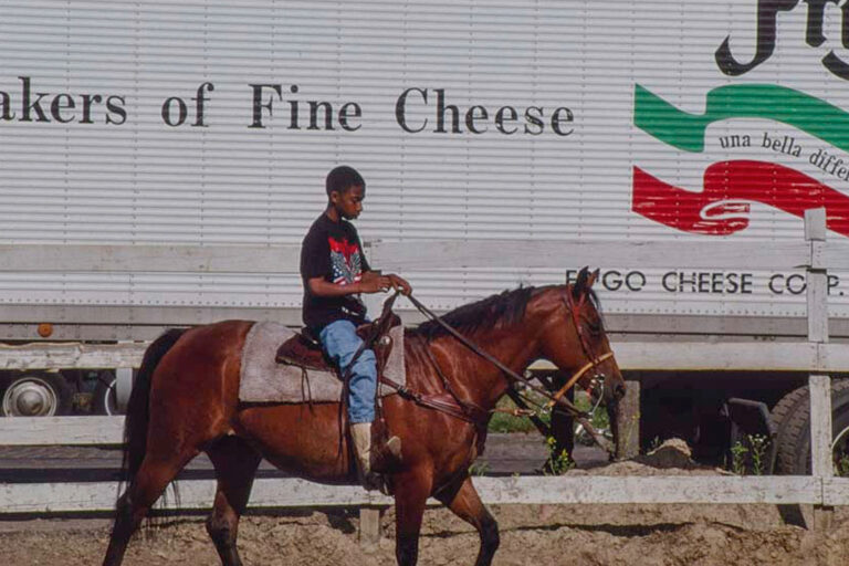 Jordan Bullock rides a horse outside White House Stable in Philadelphia in 1993.