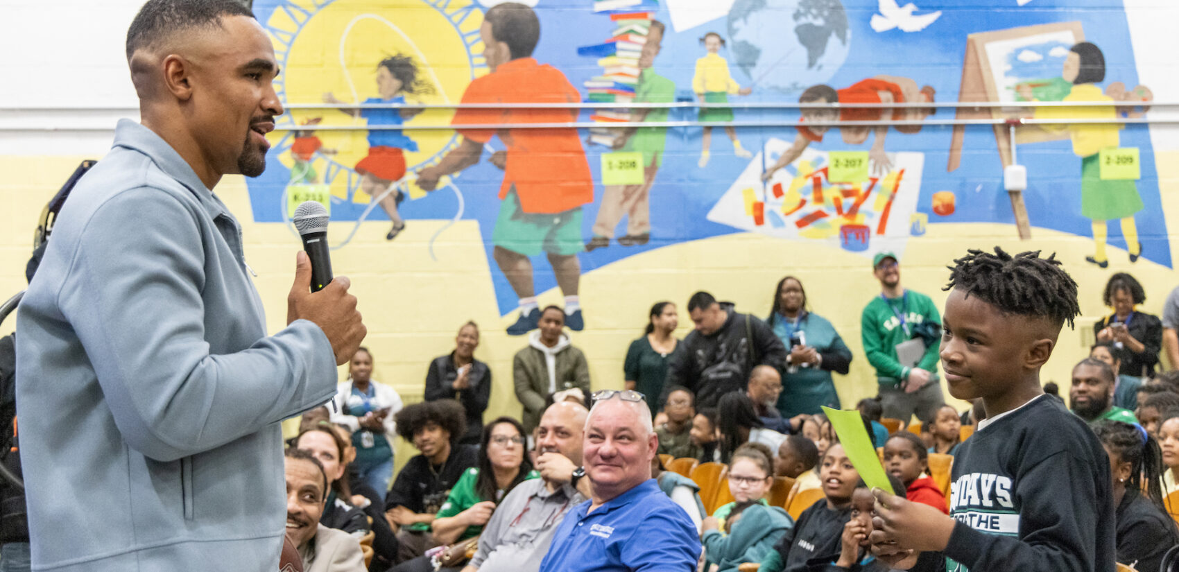 Jalen Hurts speaking with school children
