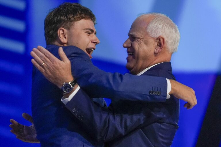 Tim Walz embracing his son on stage at the DNC