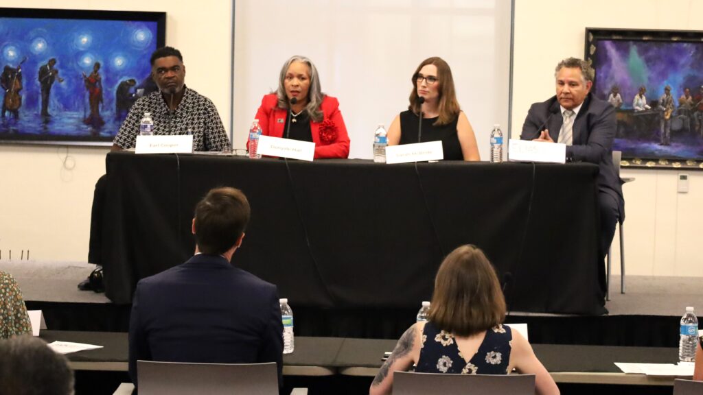 House debate-delaware-congress-s-mueller-2024-08-27-1 4 candidates sitting at table for debate