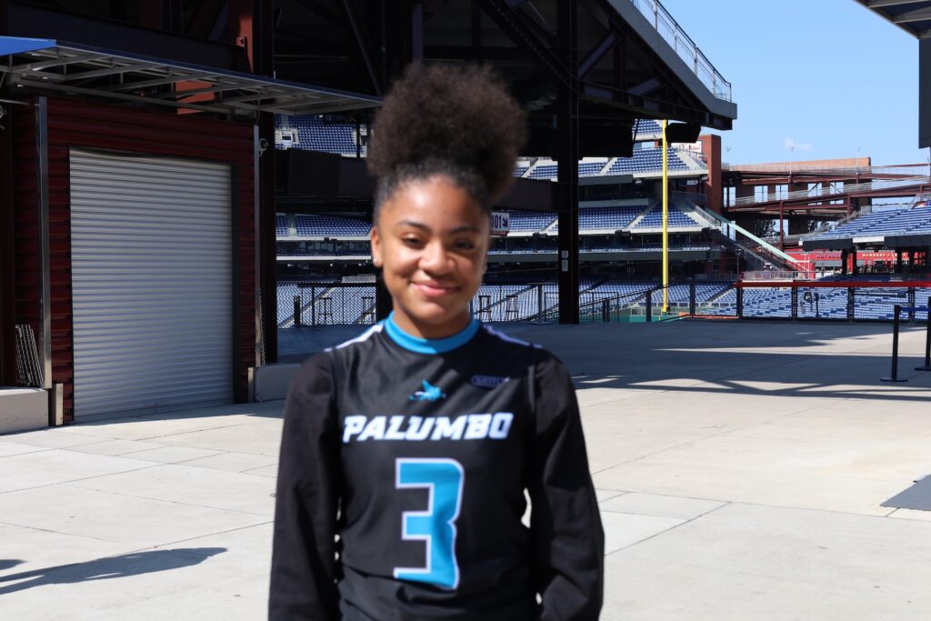 Raniyah Bennett, quarterback of the Palumbo Girls Flag Football team, spoke at Ring The Bell event at Citizens Bank Park on Aug. 13, 2024.