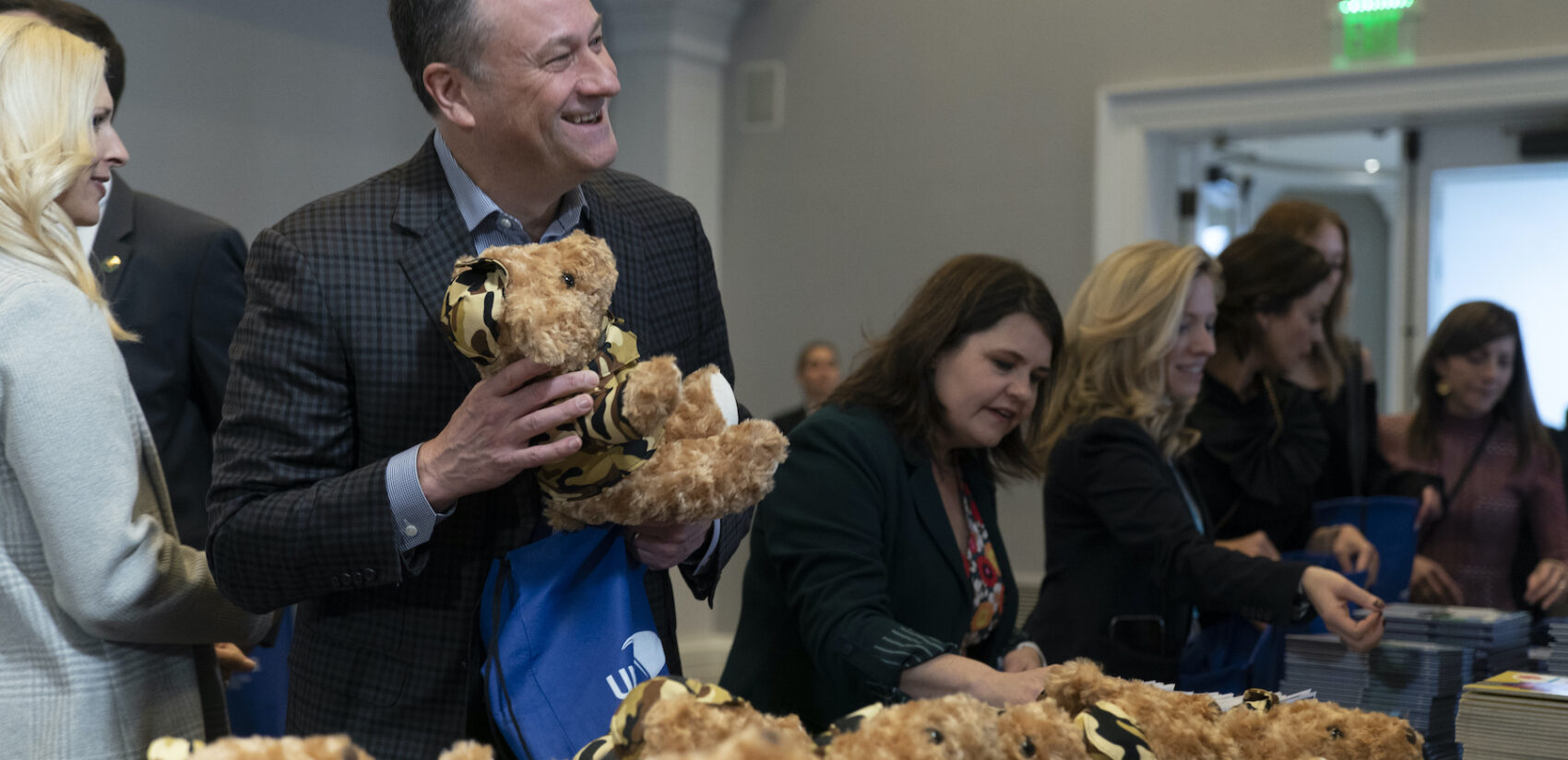 Doug Emhoff holding a stuffed animal