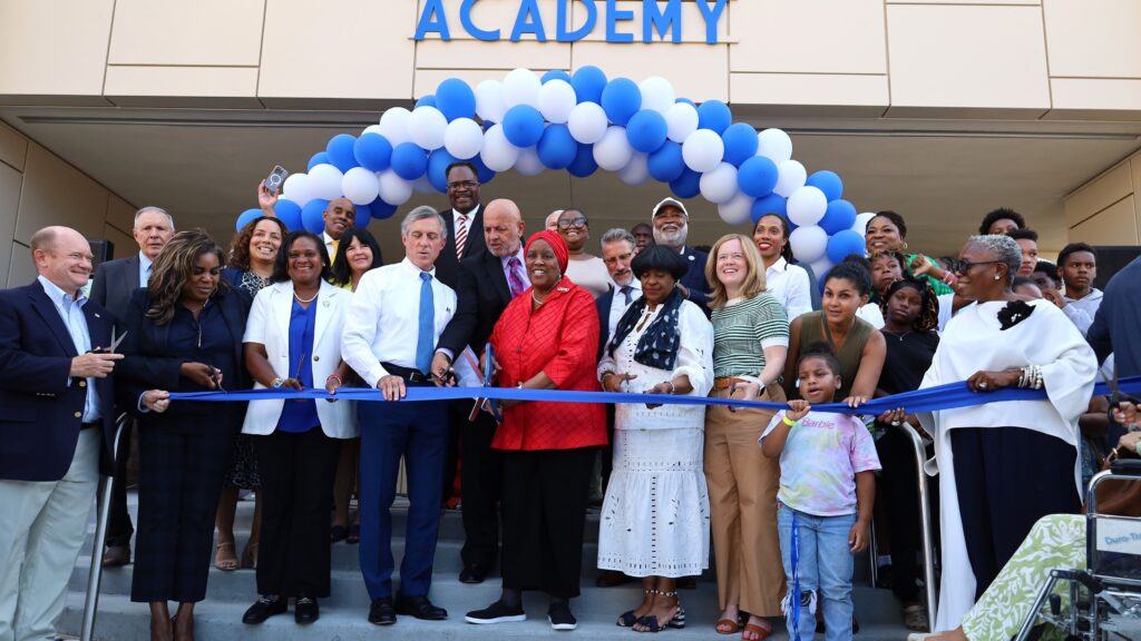 People gathered to cut the ribbon