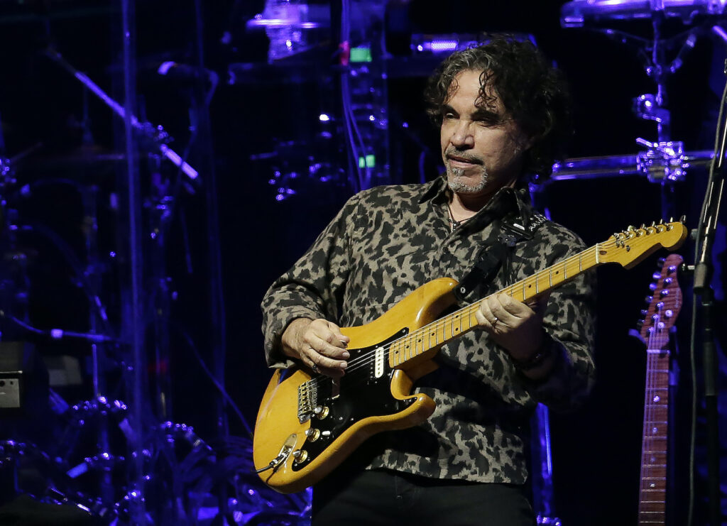 Music-John Oates John Oates playing guitar on stage