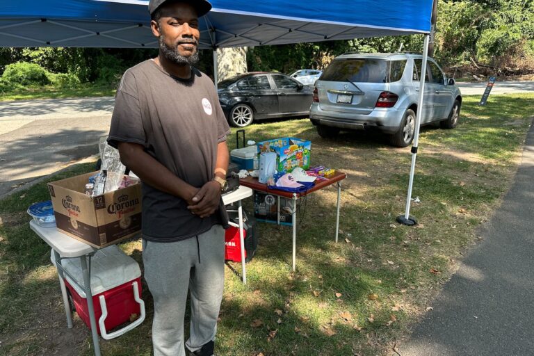 William Blocker with snacks set up on the side of the road