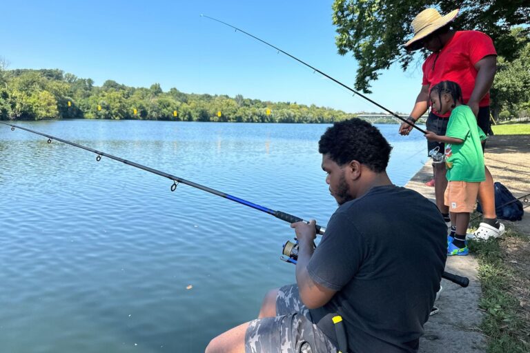 People fishing in the Schuylkill River