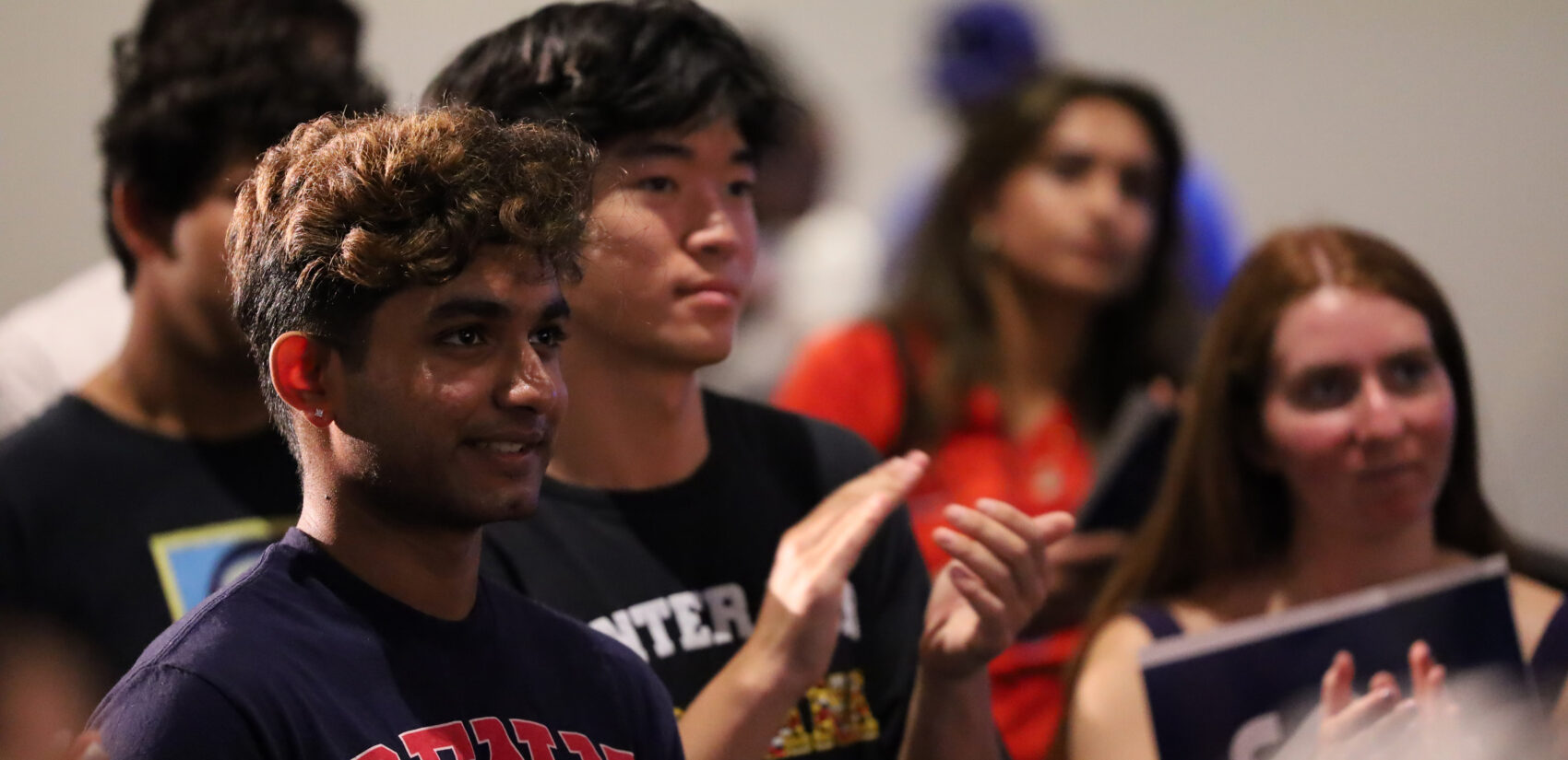 Audience members listen