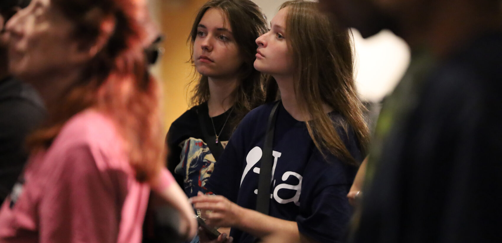 Audience members listen