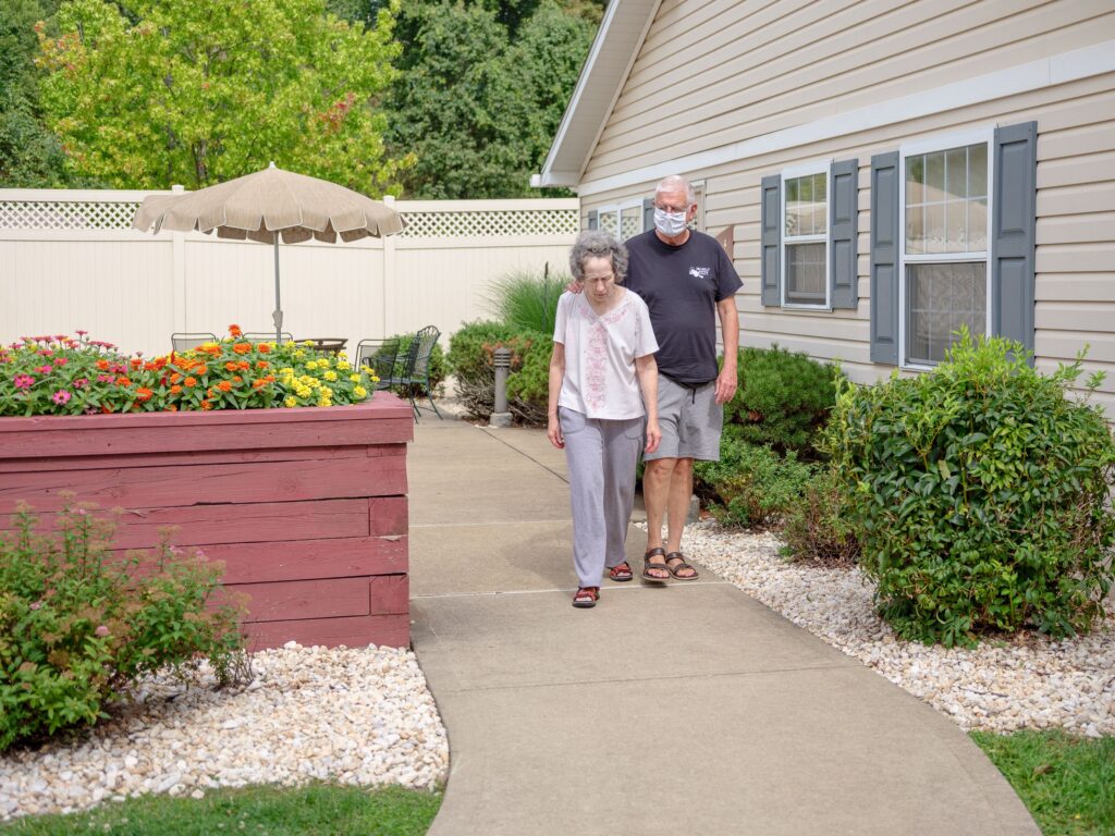 alzheimers-spotlight-pa-2024-08-06 people walking in a long-term care facility