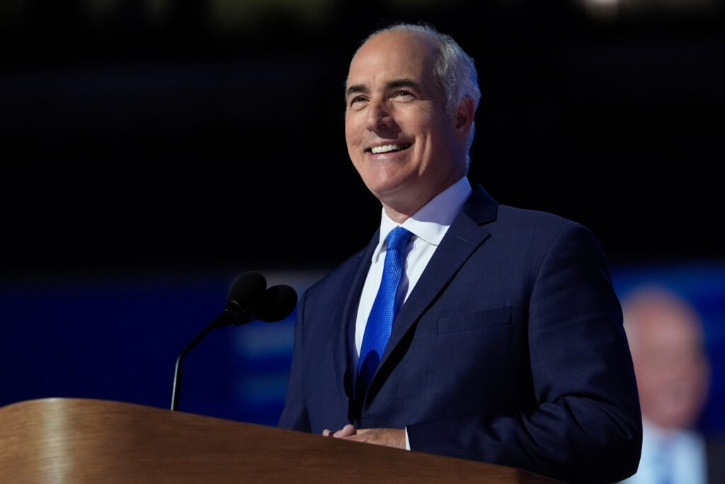 bob-casey-2024-08-22-3 Bob Casey smiles behind a podium