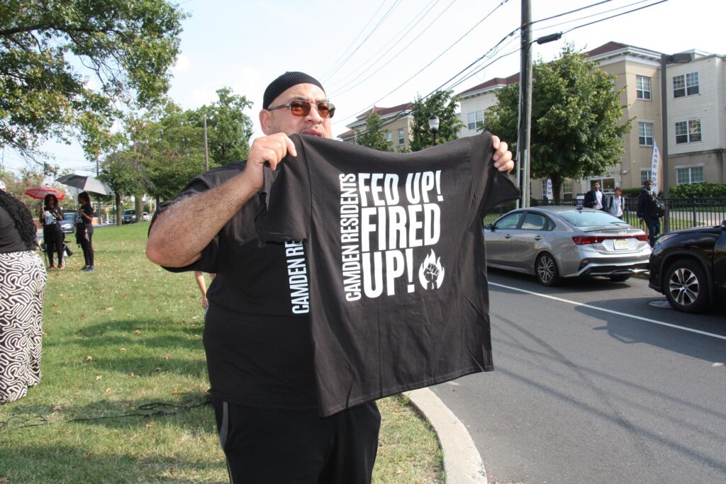 Faheem Lea, a grassroots activist and imam in Camden, drawing attention to drivers along Park Boulevard