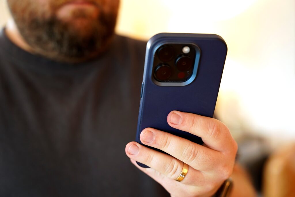 cell-phone-stock a person holds a cell phone