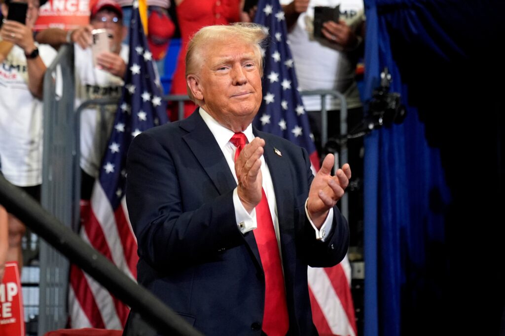donald-trump-2024-08-03 Donald Trump claps in front of a crowd