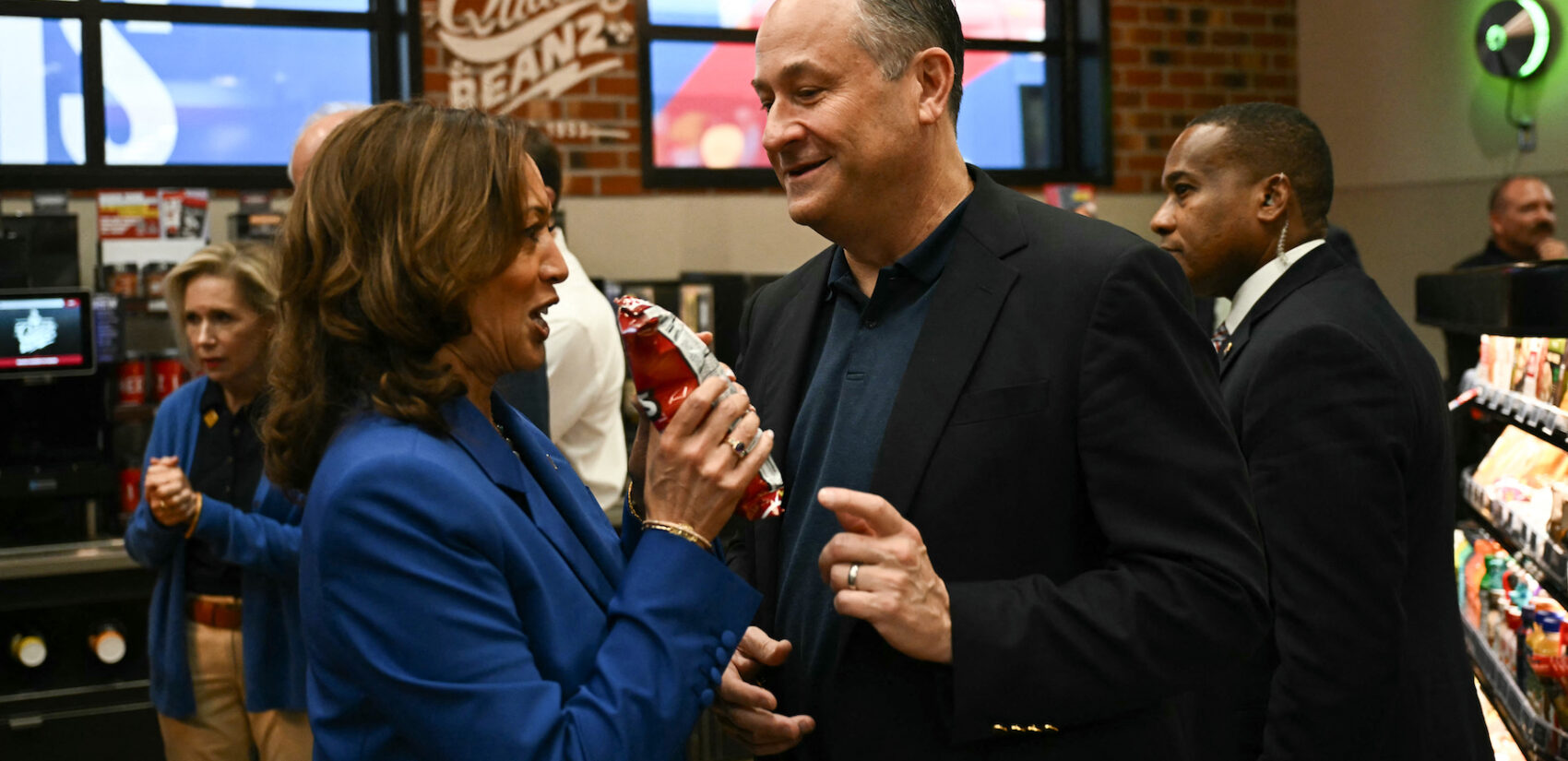 Kamala Harris and Doug Emhoff holding a bag of chips