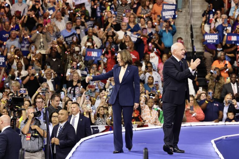 Kamala Harris Tim Walz greet the crowd at the rally