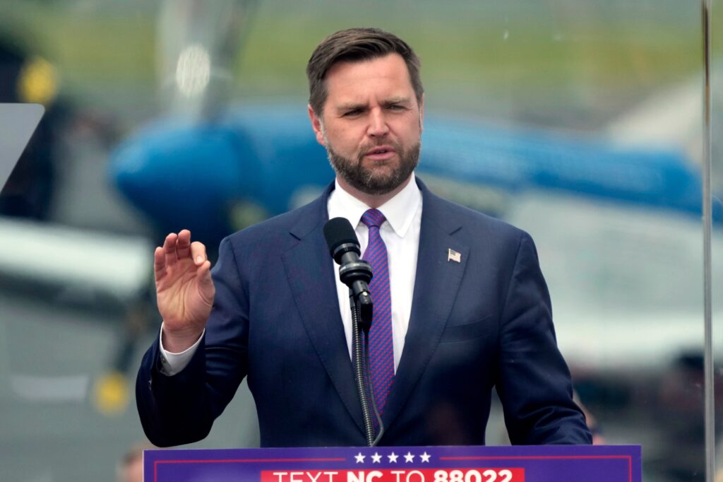 jd-vance-2024-08-21 JD Vance speaks behind a podium