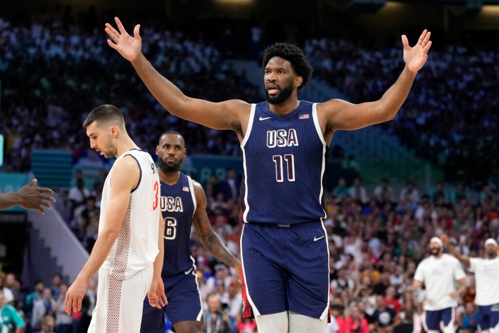joel-embiid-paris-olympics-2024 Joel Embiid with his hands up