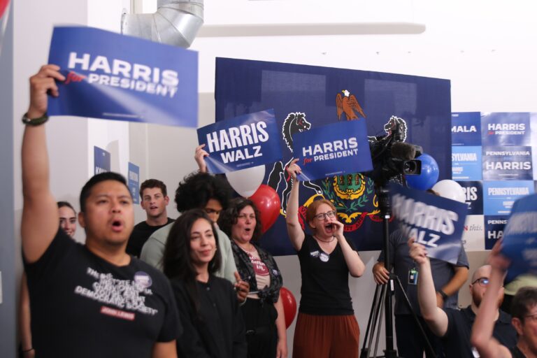 People holding Harris for President signs