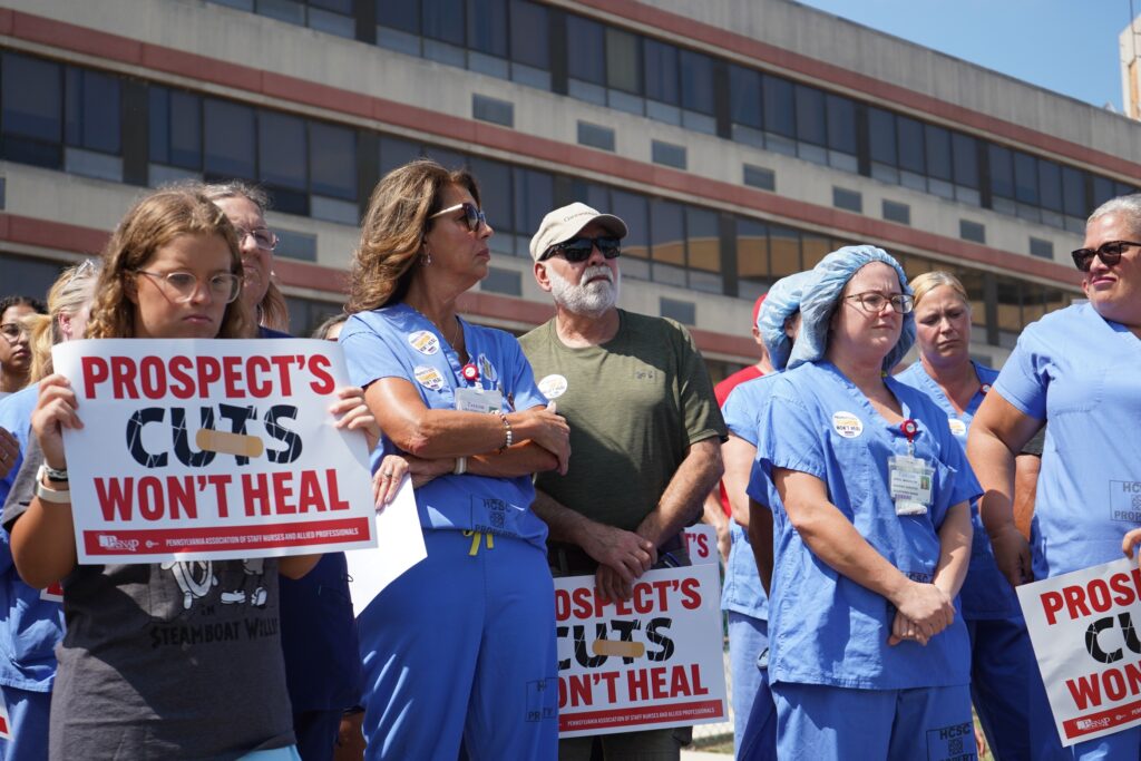 taylor-hospital-union-rally-3 Lisa Konialian and other nurses stand, some holding signs reading PROSPECT'S CUTS WON'T HEAL