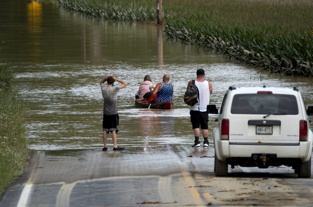 Tropical Weather Debby People paddle through a flooded area of New York following Tropical Storm Debby