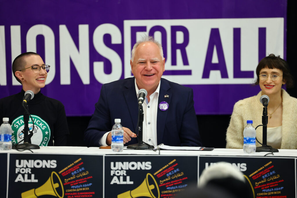 Minnesota Essential Workers Call For Unions For All At Roundtable With Gov. Tim Walz Tim Walz speaking at a table
