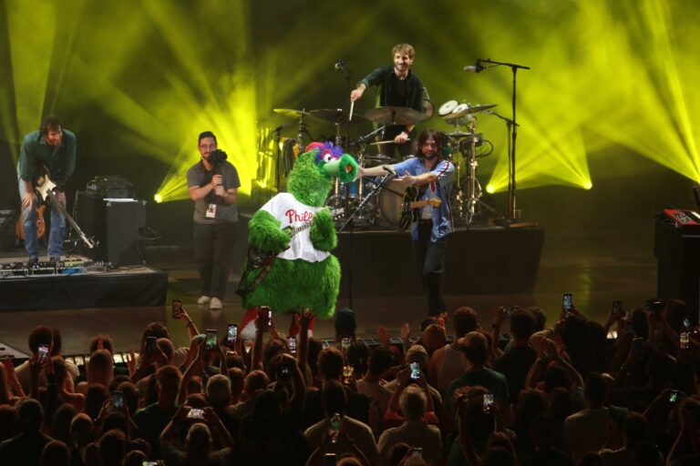 Mt. Joy onstage with the Phillie Phanatic