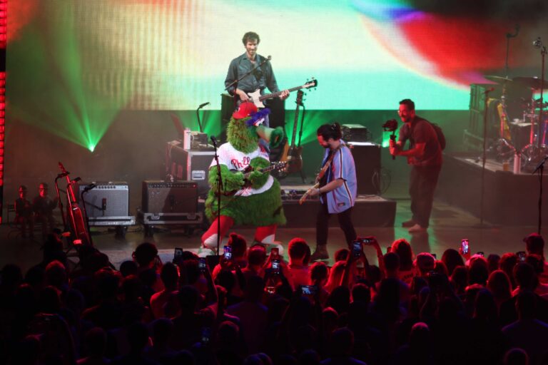 Mt. Joy onstage with the Phillie Phanatic