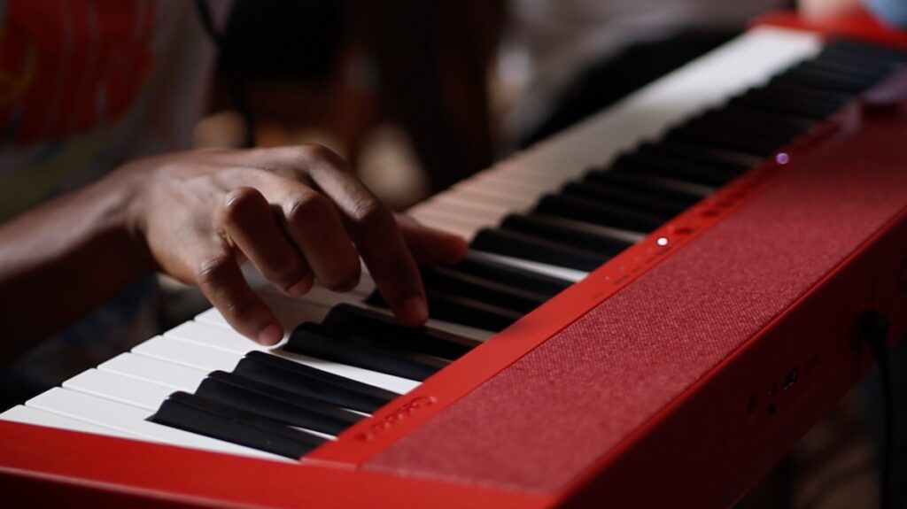 At Beyond the Bars, a community based and student-driven music program in Philadelphia, a student plays the keyboard. (Miguel Perez/WHYY) At Beyond the Bars, a community based and student-driven music program in Philadelphia, a student plays the keyboard. (Miguel Perez/WHYY)