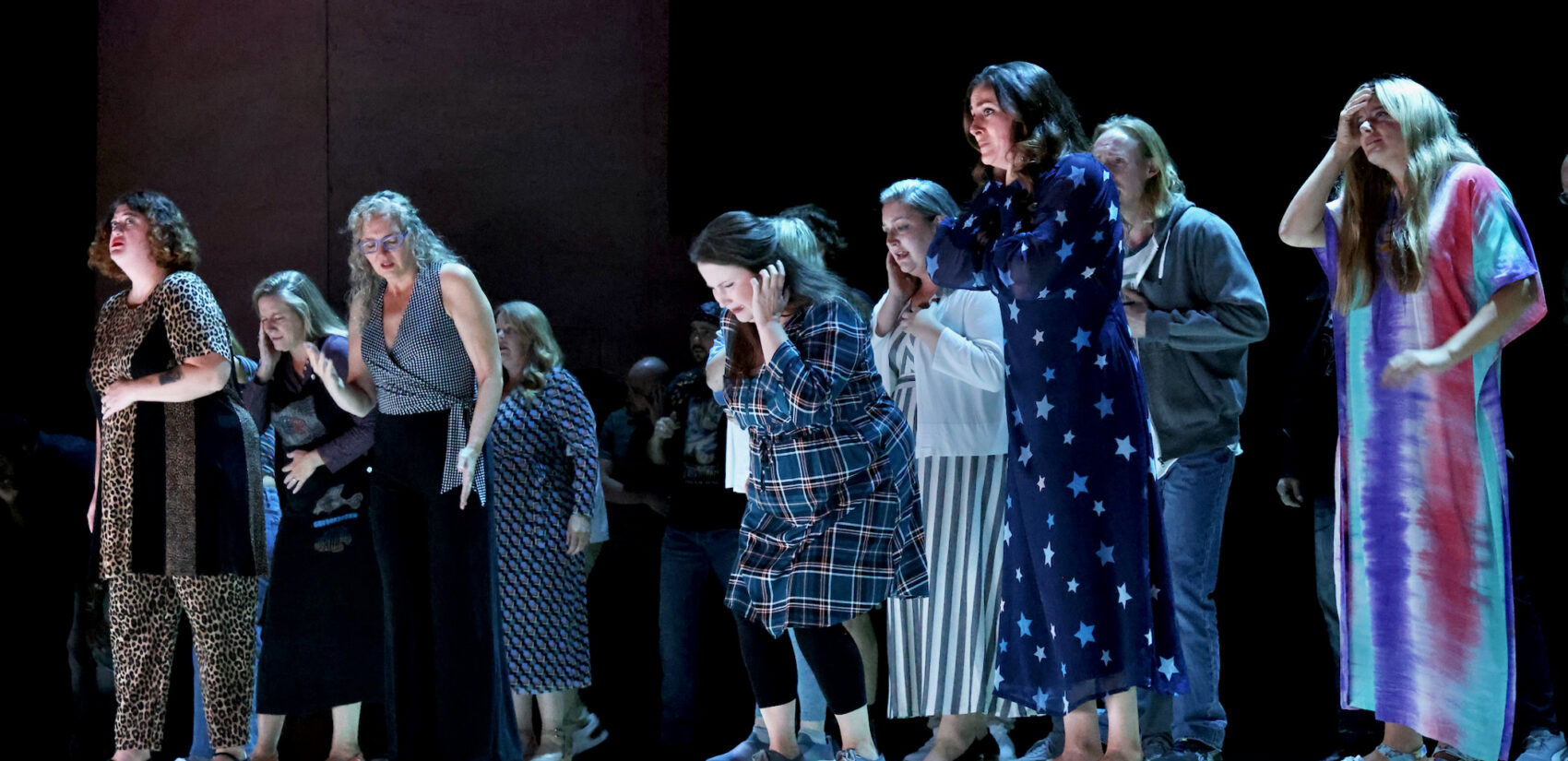actors onstage hearing the hum