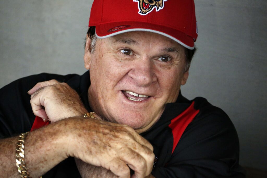 Pete Rose Pete Rose sits in the Washington Wild Things dugout before a Frontier League baseball game against the Lake Erie Crushers in Washington, Pa, Tuesday, June 30, 2015. Rose coach each baseline for a half inning for the Wild Things after which fans could pay for an autograph and to have their picture take with him. (AP Photo/Gene J. Puskar)