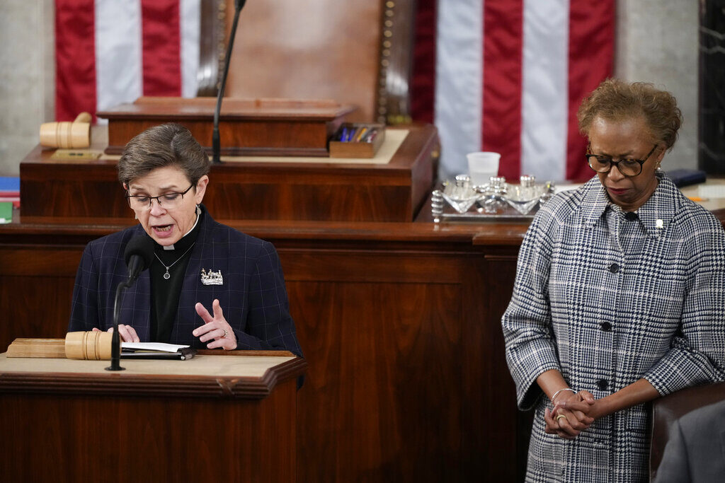 Congress House Chaplain retired Rear Adm. Margaret Kibben offers a prayer as Clerk of the House of the Representatives Cheryl Johnson bows her head in the House chamber as the House meets for the fourth day to elect a speaker and convene the 118th Congress in Washington, Friday, Jan. 6, 2023. (AP Photo/Andrew Harnik)