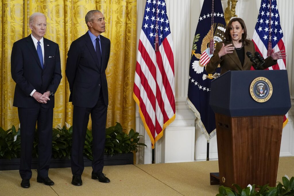 Joe Biden, Barack Obama, Kamala Harris Kamala Harris speaking at a podium with Joe Biden and Barack Obama standing beside her