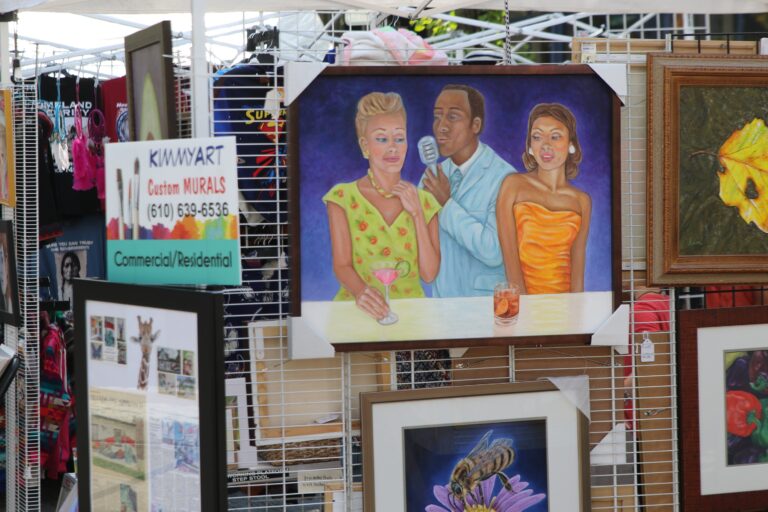 paintings on a rack