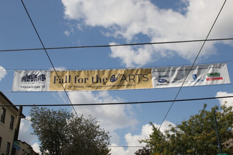 an overhead sign for the festival