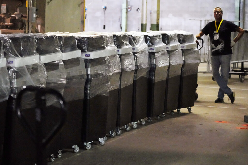 Elections 2024 Testing Explainer voting machines in a warehouse