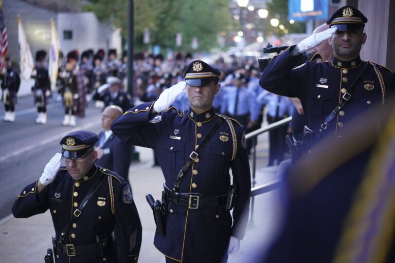 Three officers salute