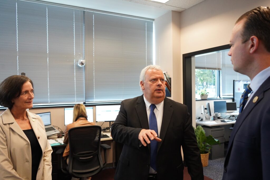 Pennsylvania DHS Secretary Dr. Val Arkoosh, Chester County Human Services Director Pat Bokovitz, and Chester County Commissioner Eric Roe walk through the new call center Officials walk through Chester County's new call center to respond to mental health crises