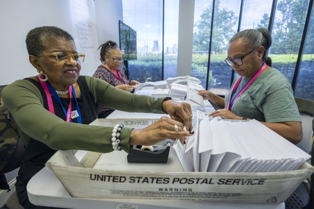 Carol Hamilton, Cristo Carter, Cynthia Huntley Preparing mail-in ballots
