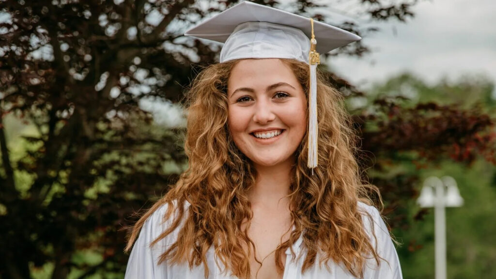 Truly-Graduation-pic-1-e1725734893223 copy Truly Heft wearing a white graduation robe