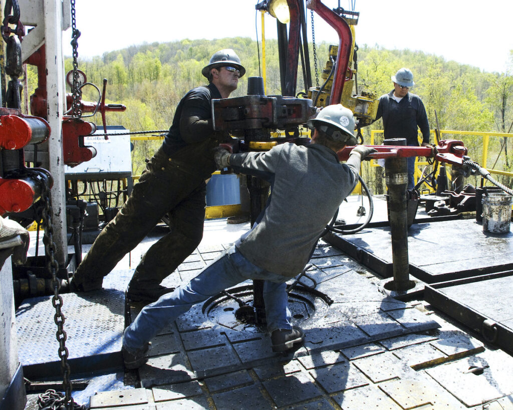 Natural gas Workers at Chesapeake Energy natural gas well site