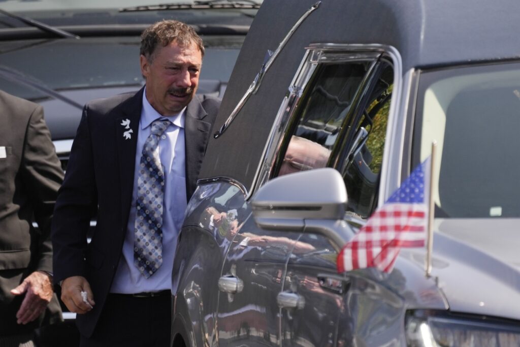 APTOPIX Gaudreau Brothers Funeral Guy Gaudreau looks into a hearse