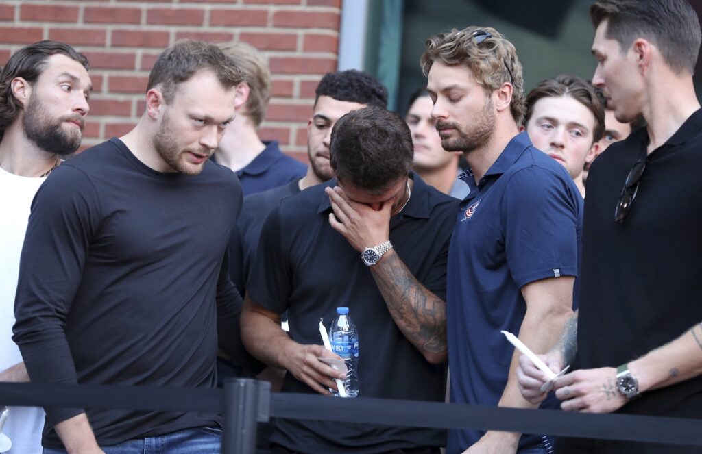 Cole SIllinger, Johnny Gaudreau Columbus Blue Jackets players at vigil