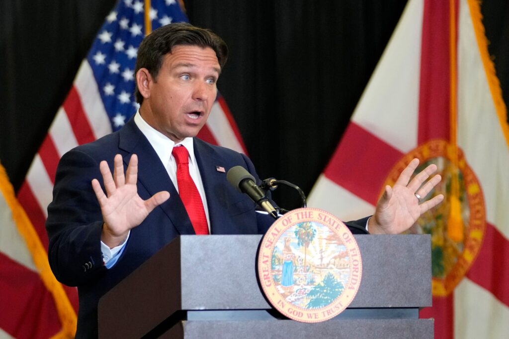 desantis-2024-09-17 Ron DeSantis speaks behind a podium