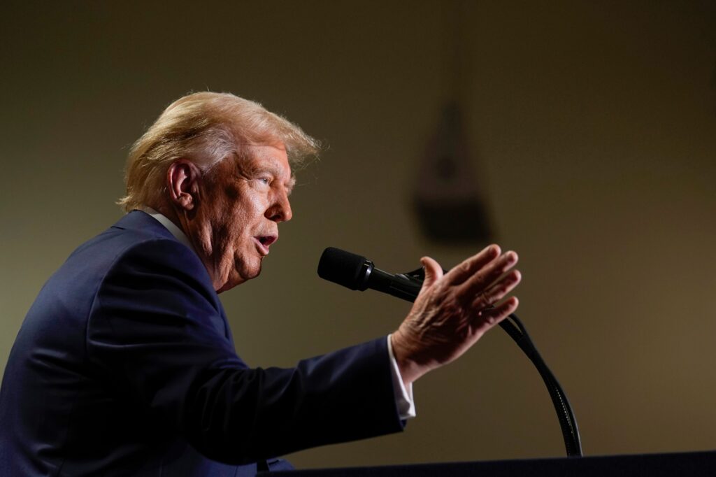 donald-trump-2024-09-29 Donald Trump speaks into a microphone
