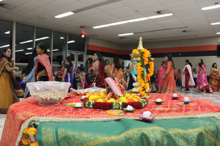 Dancers dancing next to a table