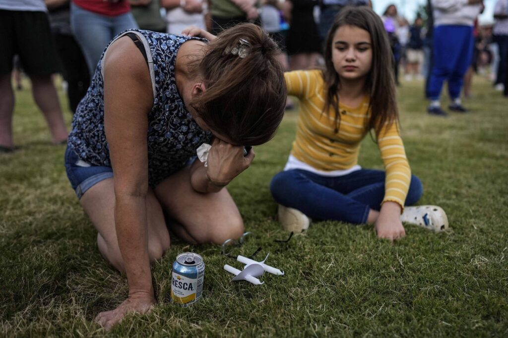 Georgia School Shooting Brandy Rickaba and her daughter Emilie pray during a candlelight vigil for the slain students and teachers at Apalachee High School, Wednesday, Sept. 4, 2024, in Winder, Ga.
