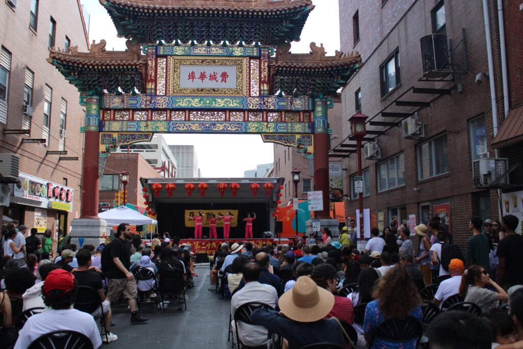 mid-autumn-festival-2 attendees watch a performance under the Chinatown Arch