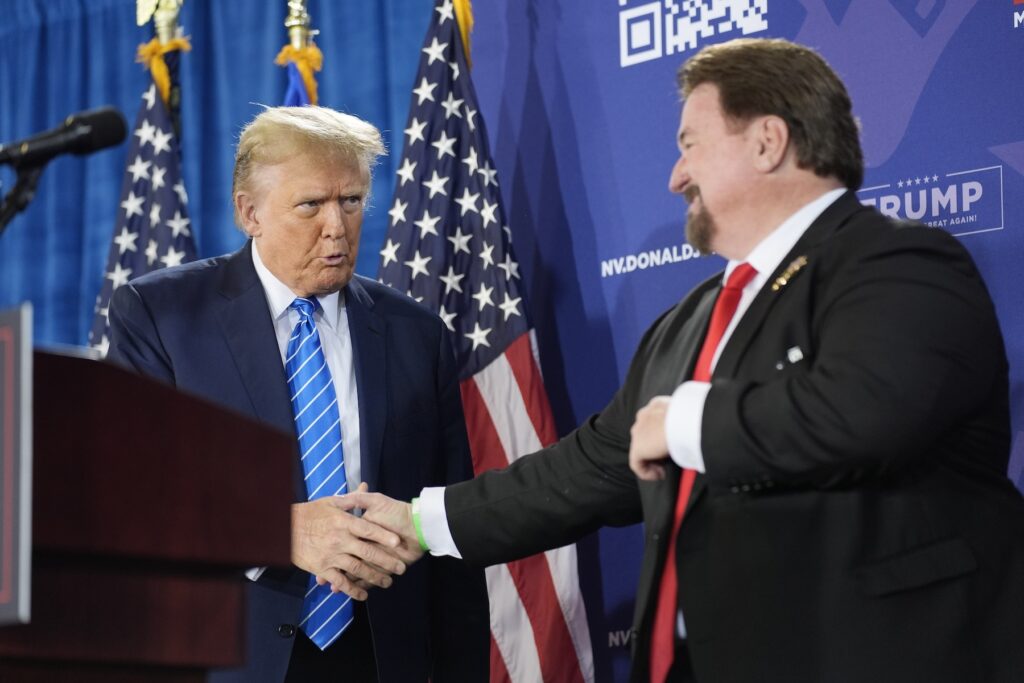 Fake Electors-Nevada Michael McDonald shakes hands with Donald Trump